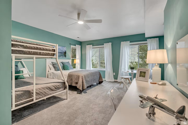 11789 Nicklaus Road Sandy, UT 84092 - Photo 31 of 58 Bedroom with light colored carpet and a ceiling fan