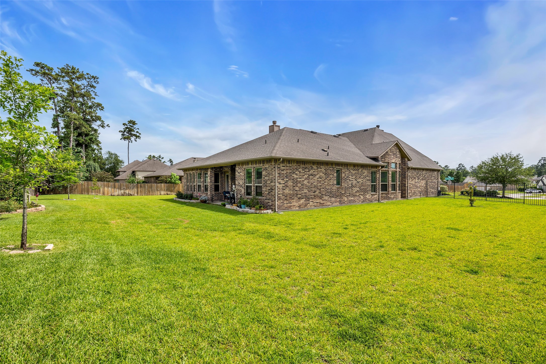 14003 South Evergreen Ridge Court Conroe, TX 77384 - Photo 36 of 43 Expansive side yards provide plenty of room for play, pets, and a future pool.