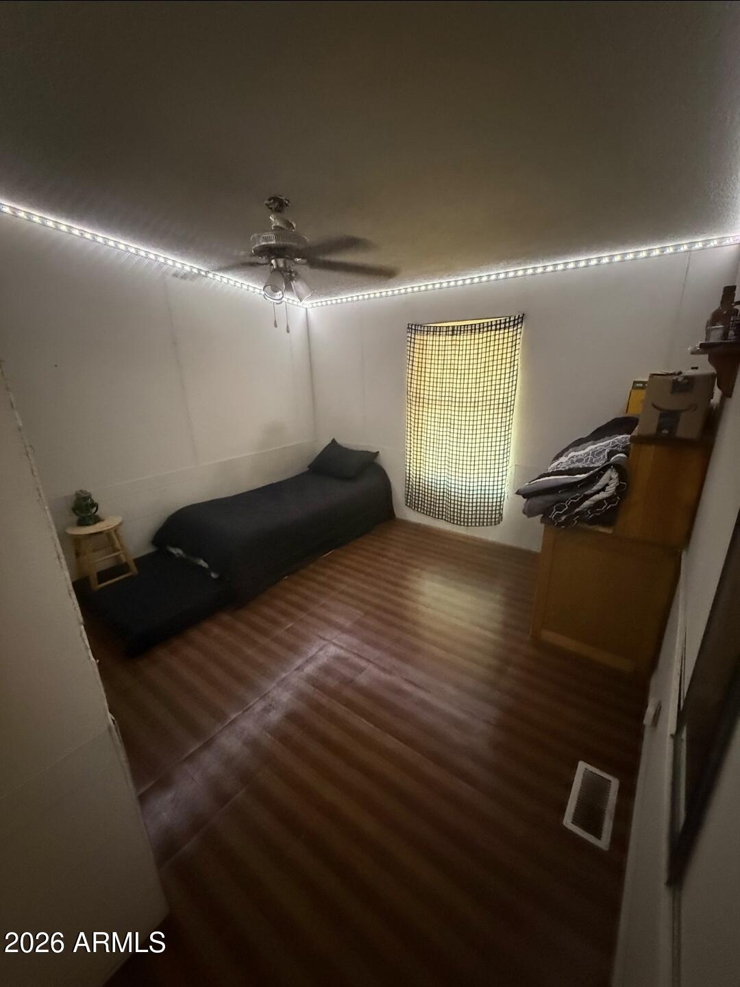 2625 Saddle Vista Road Tonopah, AZ 85354 - Photo 12 of 19 a bedroom with a bed and a chandelier