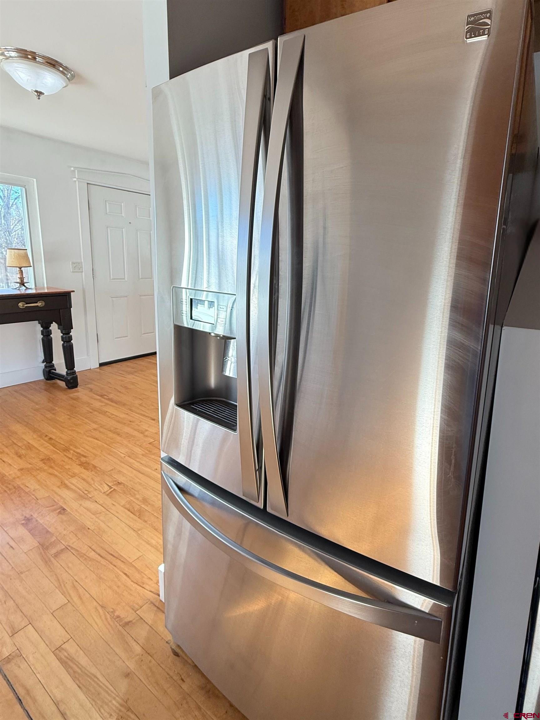 458 Price Road Paonia, CO 81428 - Photo 23 of 44 a view of a refrigerator in kitchen and an empty room