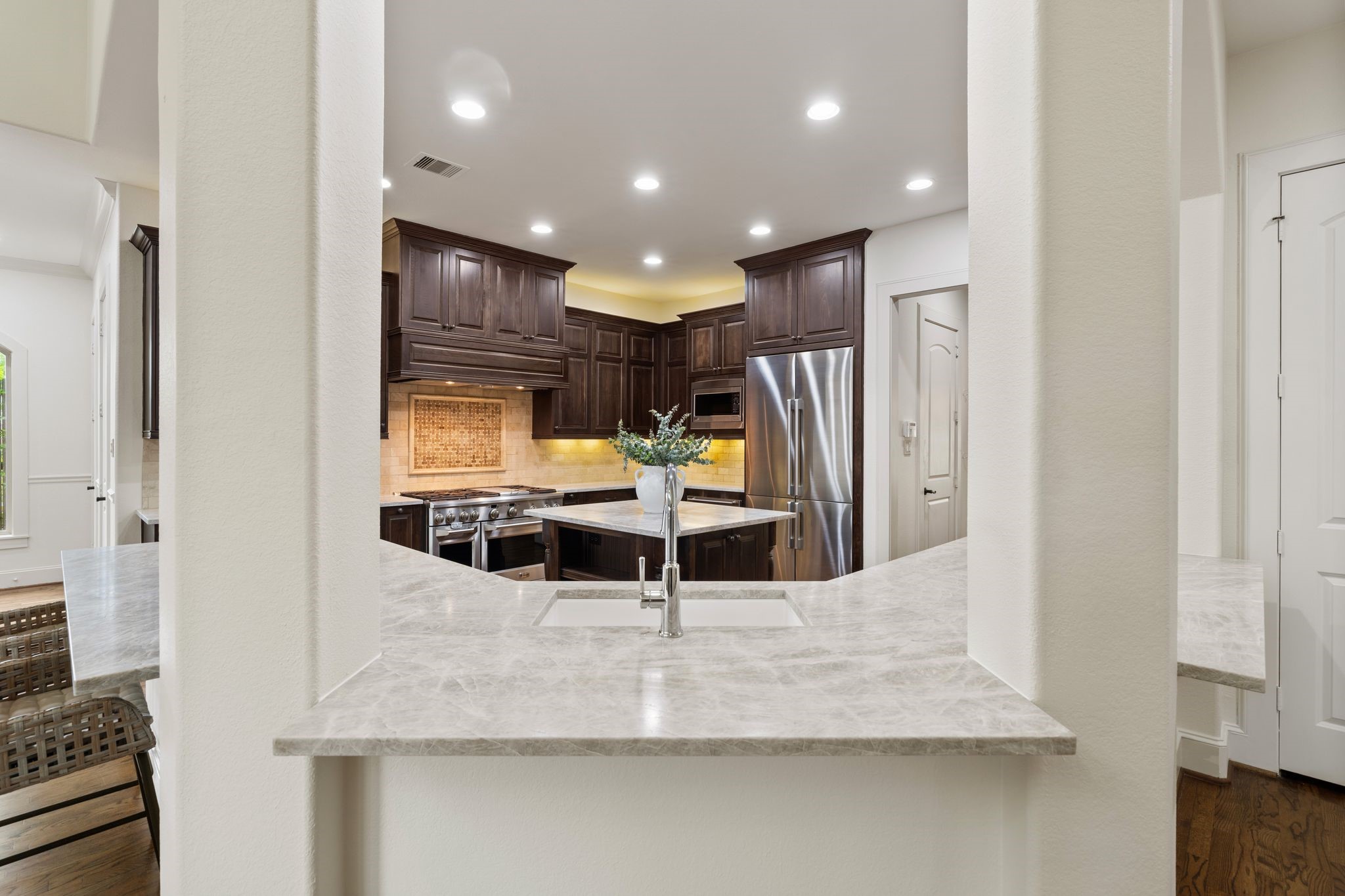 1418 Du Barry Lane Houston, TX 77018 - Photo 12 of 45 a room with stainless steel appliances kitchen island sink refrigerator and stove