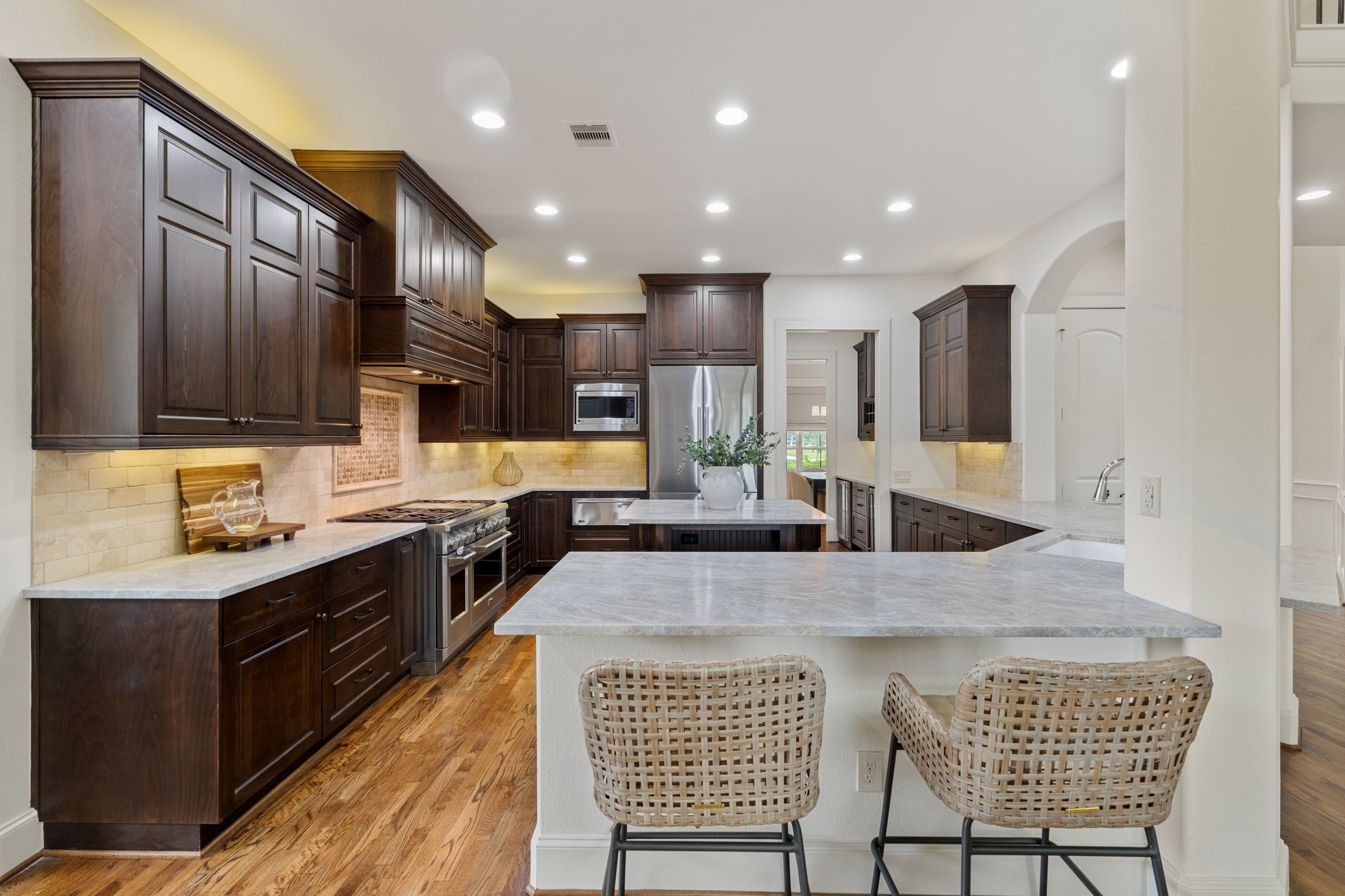 1418 Du Barry Lane Houston, TX 77018 - Photo 15 of 45 a kitchen with stainless steel appliances kitchen island granite countertop a sink and cabinets