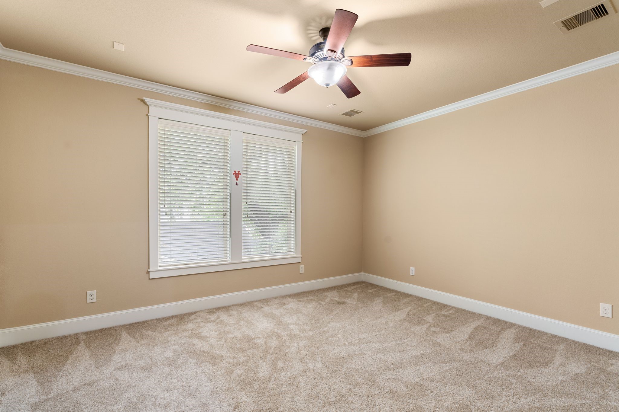 1418 Du Barry Lane Houston, TX 77018 - Photo 30 of 45 an empty room with a window and a fan