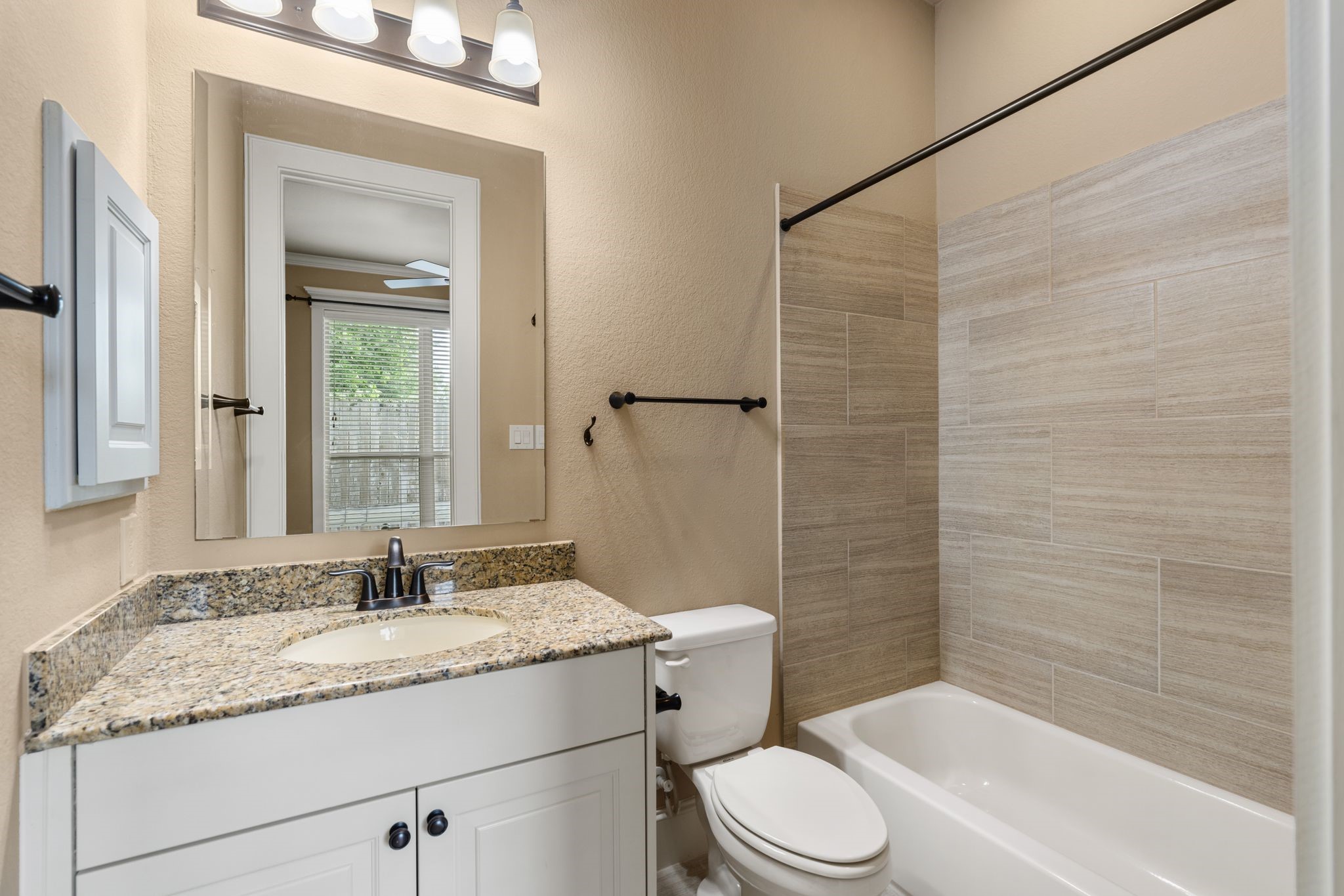 1418 Du Barry Lane Houston, TX 77018 - Photo 32 of 45 a bathroom with a granite countertop sink toilet and shower