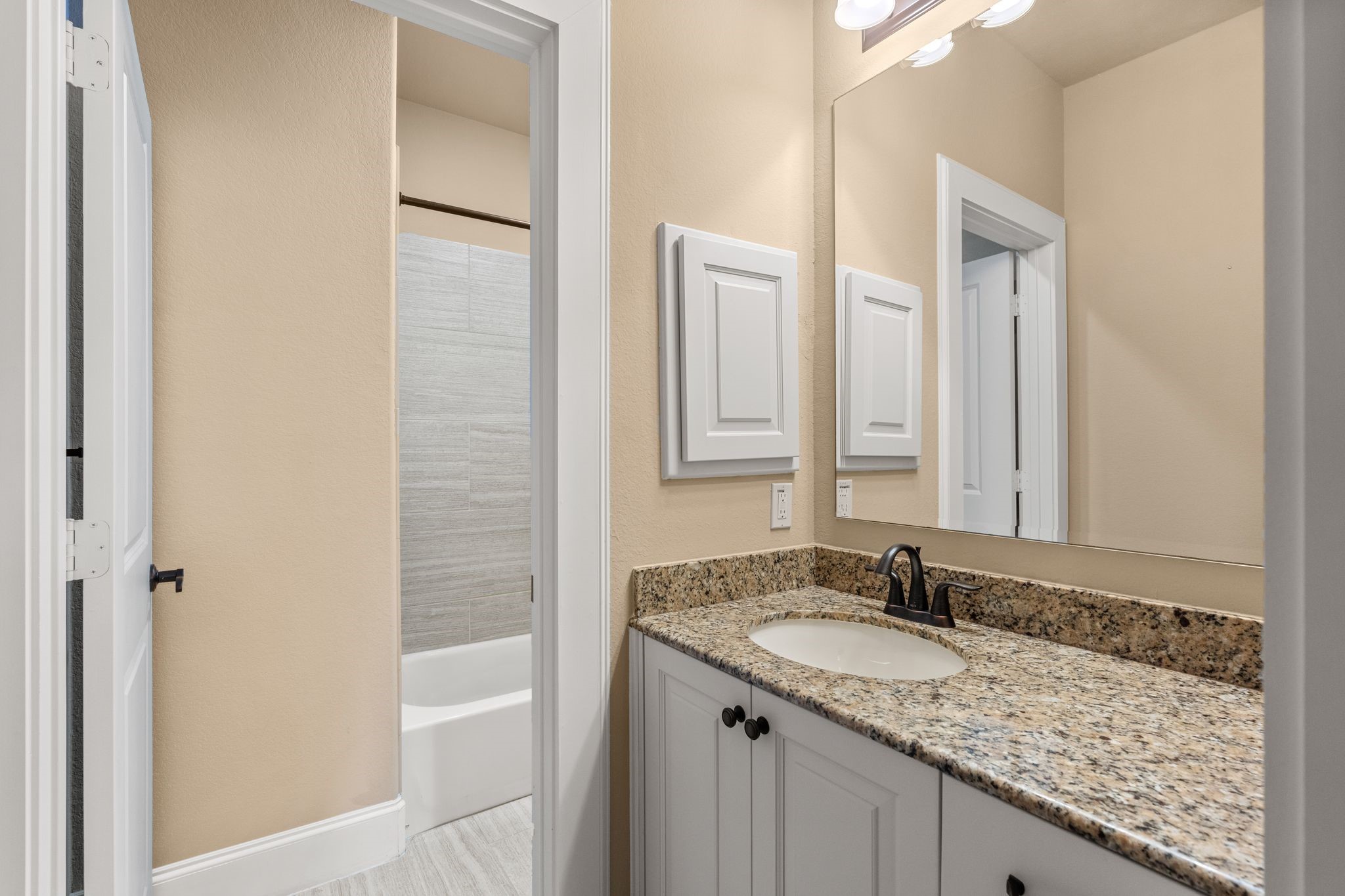 1418 Du Barry Lane Houston, TX 77018 - Photo 36 of 45 a bathroom with a granite countertop sink and a mirror