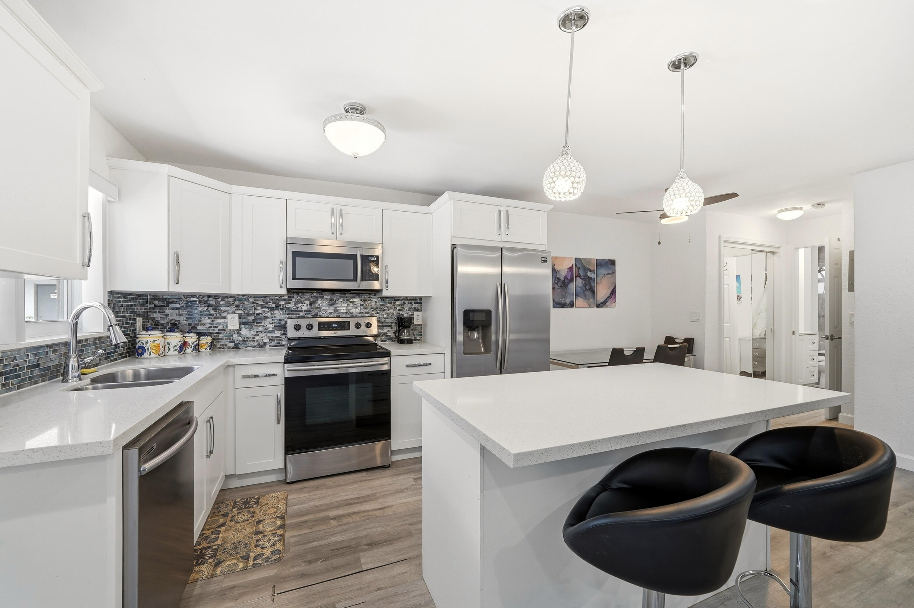 3510 Harrison Street, Unit 4 Hollywood, FL 33021 - Photo 7 of 31 a kitchen with a sink a stove and refrigerator