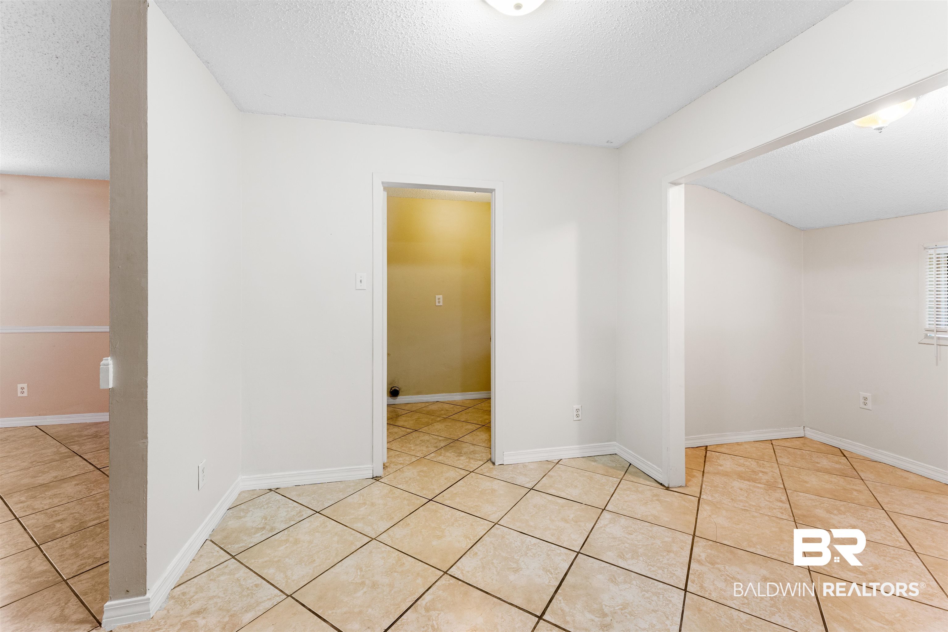 5551 Springer Court Theodore, AL 36582 - Photo 20 of 37 Unfurnished room featuring a textured ceiling and light tile patterned floors