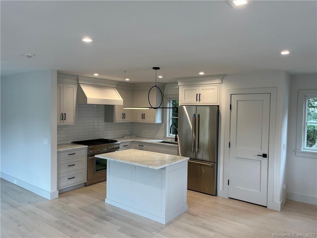 282 Tokeneke Road Darien, CT 06820 - Photo 2 of 6 a kitchen with stainless steel appliances granite countertop a sink stove and refrigerator