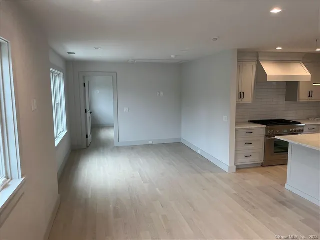 a view of a kitchen with a sink and a stove top oven