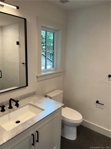 a bathroom with a sink and a toilet