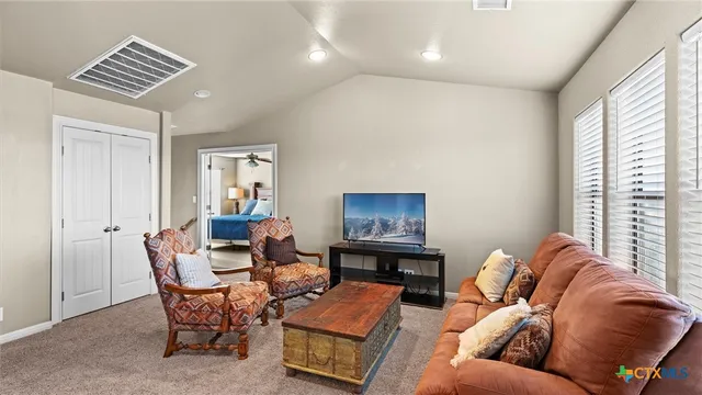 a living room with furniture and a window