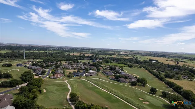 an aerial view of a city and lake view