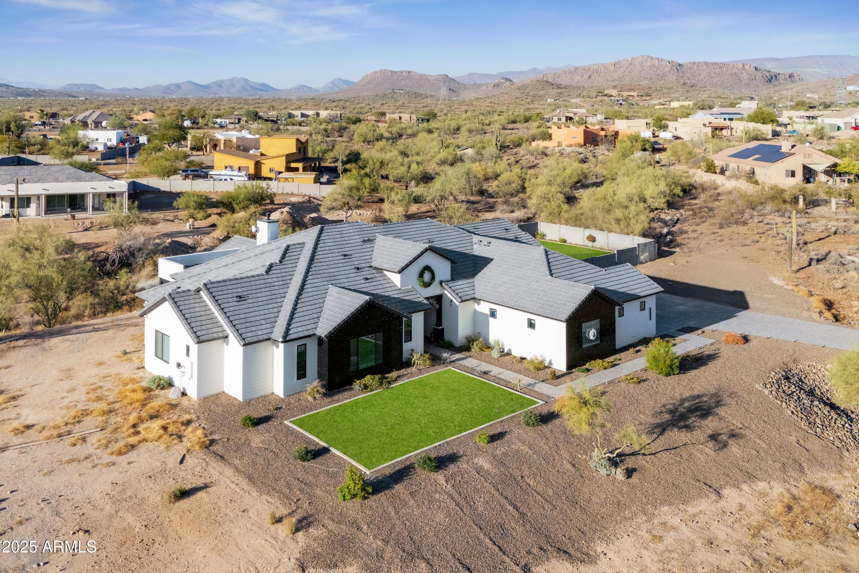 39720 North 7th Street Phoenix, AZ 85086 - Photo 7 of 11 an aerial view of a house with a mountain