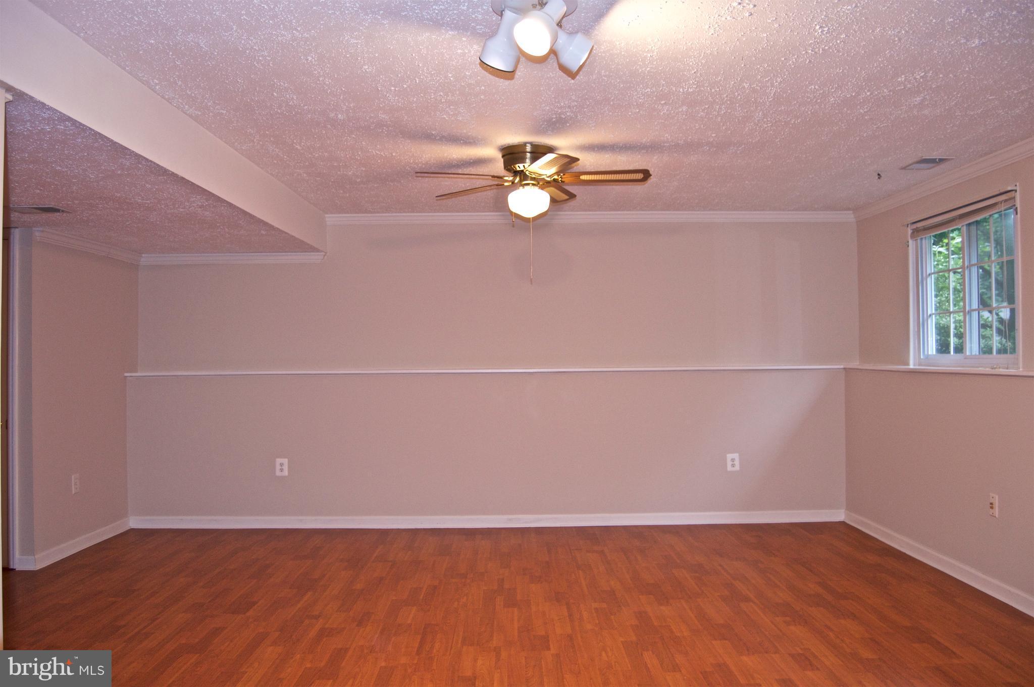 5918 Freds Oak Road Burke, VA 22015 - Photo 17 of 29 Wainscoting and Pergo Flooring