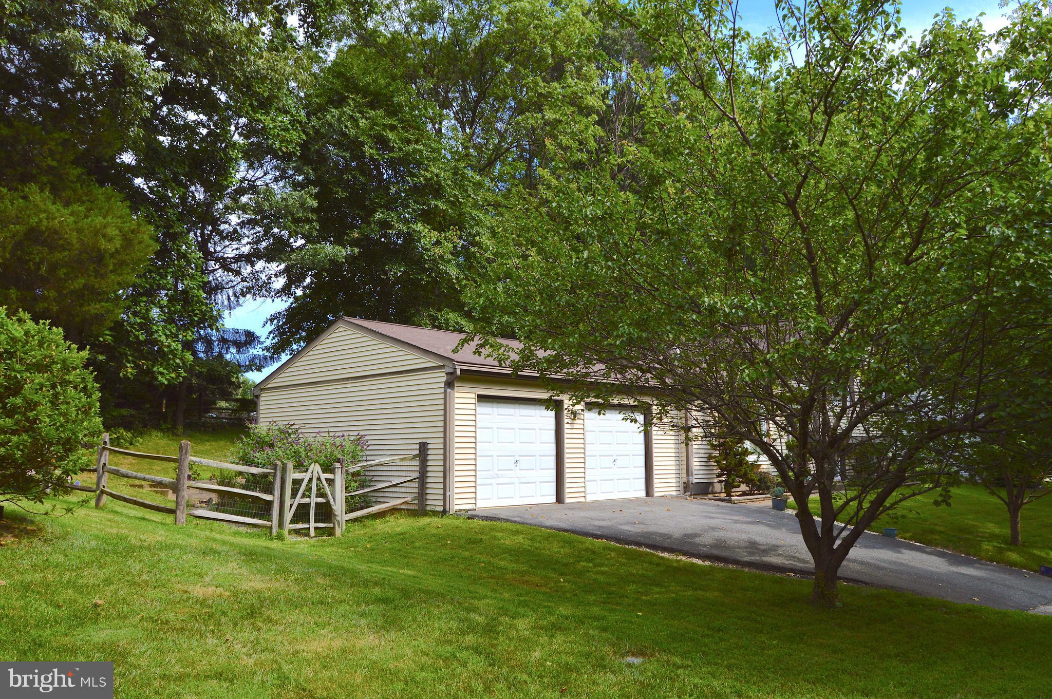 5918 Freds Oak Road Burke, VA 22015 - Photo 3 of 29 2-car garage with storage + shelving