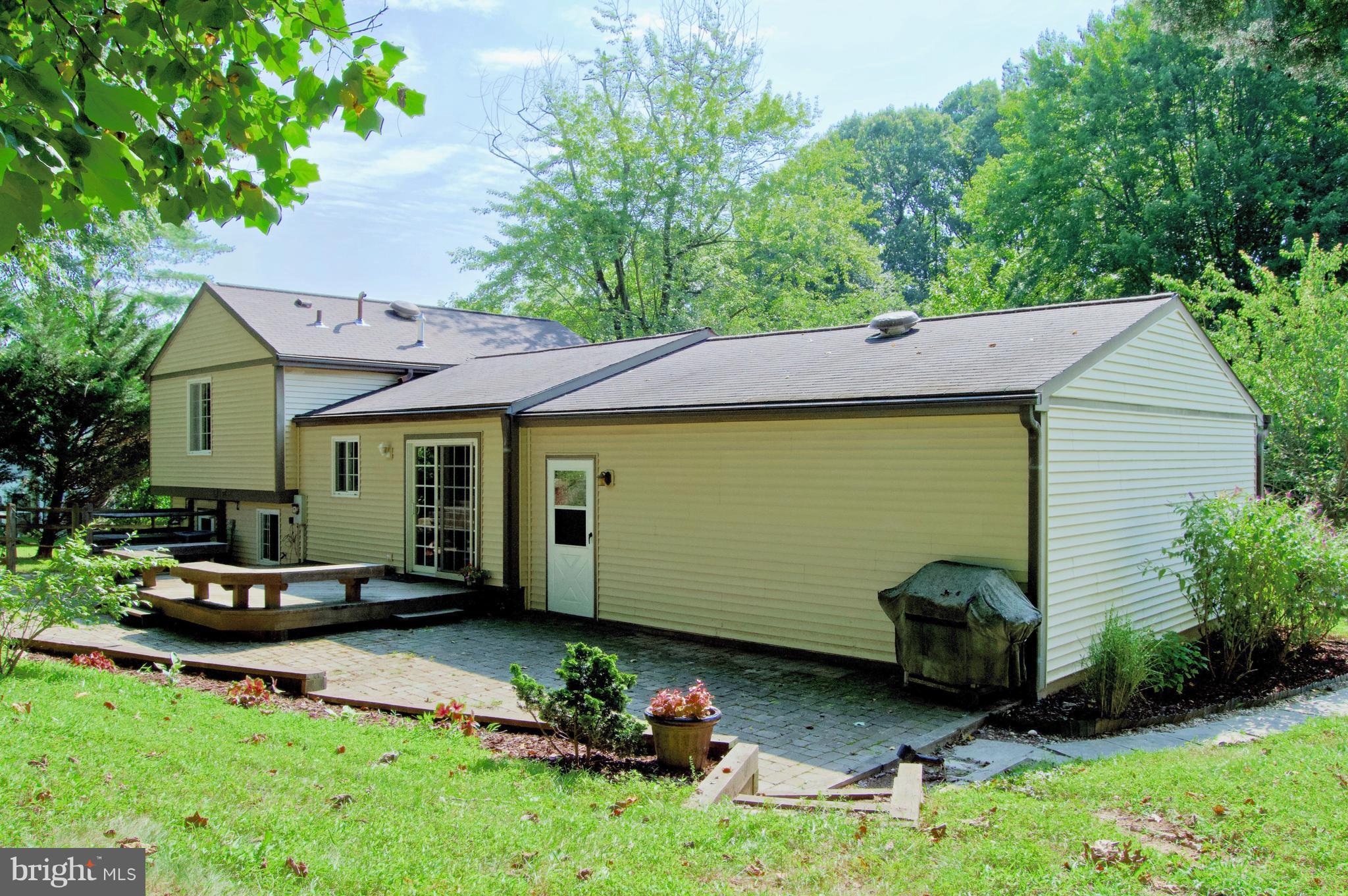 5918 Freds Oak Road Burke, VA 22015 - Photo 4 of 29 1,100 SqFt Brick Patio with Expansive Deck
