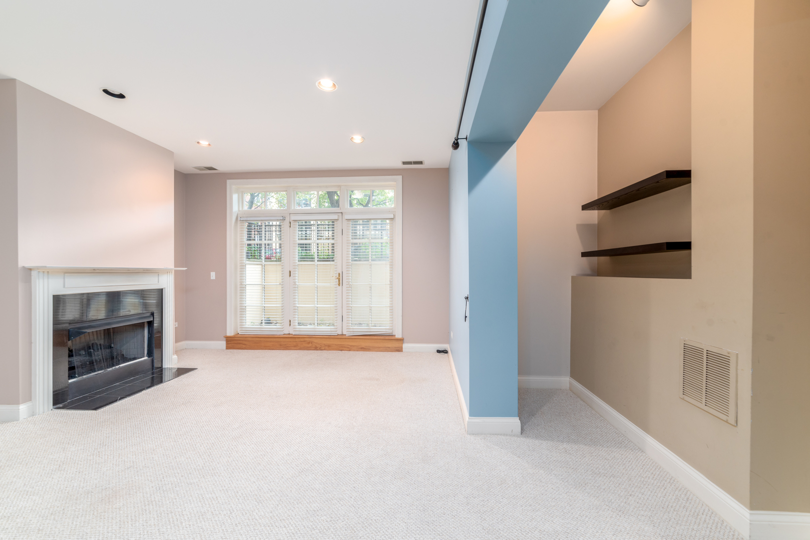 4425 North Racine Avenue, Unit 1S Chicago, IL 60640 - Photo 18 of 28 a view of an empty room with a fireplace