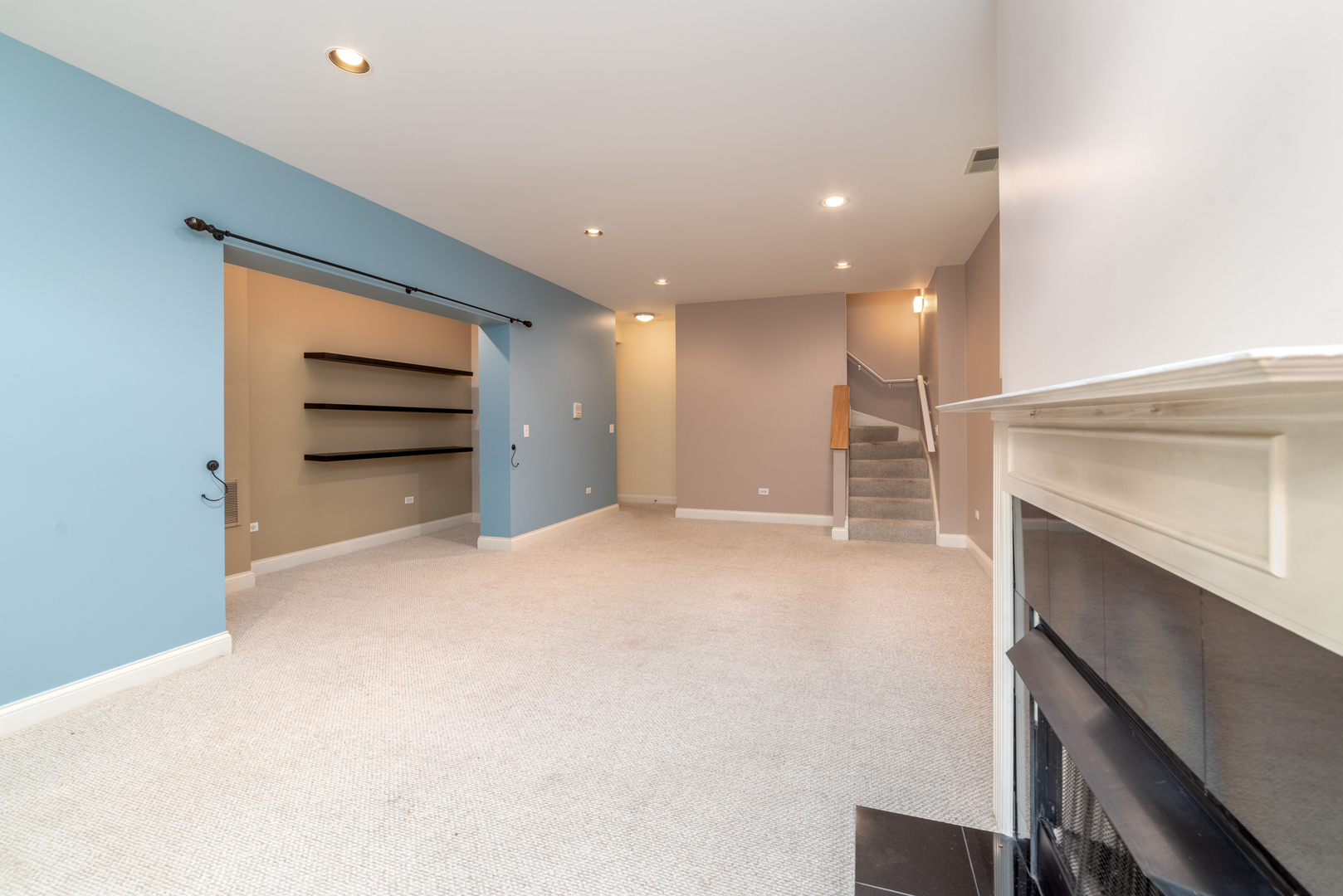 4425 North Racine Avenue, Unit 1S Chicago, IL 60640 - Photo 20 of 28 a view of an empty room with a fireplace