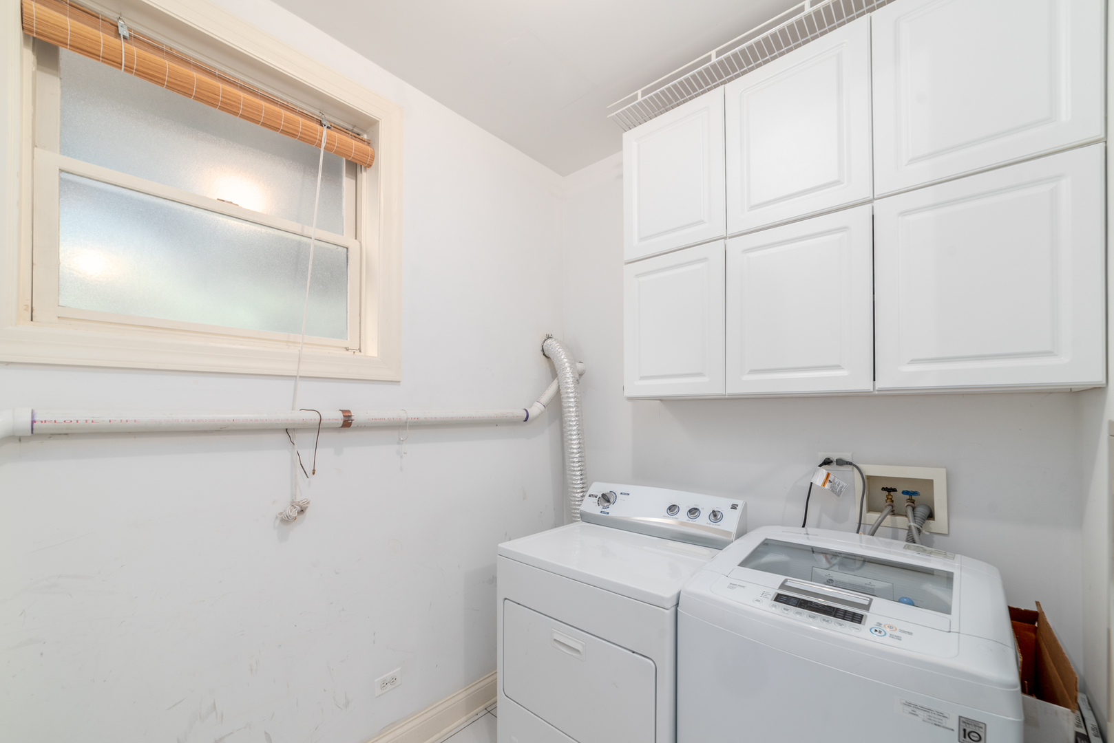 4425 North Racine Avenue, Unit 1S Chicago, IL 60640 - Photo 24 of 28 a view of storage and utility room with washer and dryer