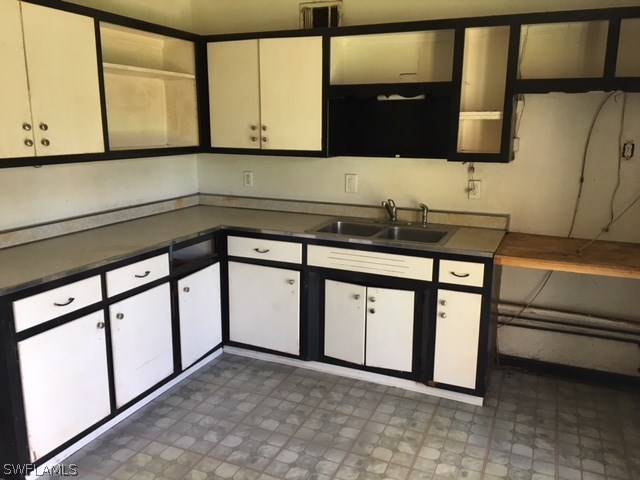 2022 Earl Road Fort Myers, FL 33901 - Photo 8 of 8 a kitchen with stainless steel appliances granite countertop a sink and a microwave