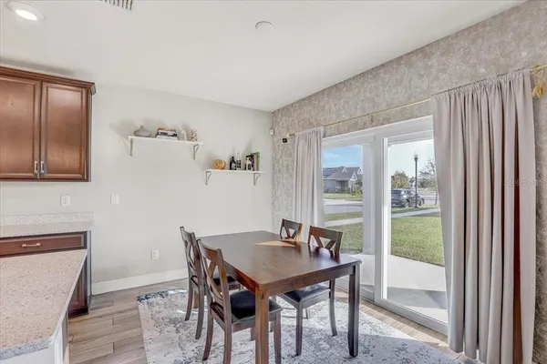 a view of a dining room with furniture window and outside view