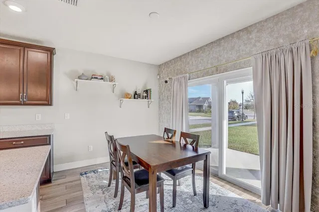 a view of a dining room with furniture window and outside view
