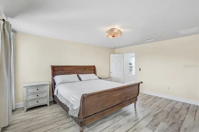 a bedroom with a bed and a table