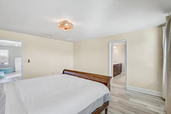 a bedroom with a bed and a table