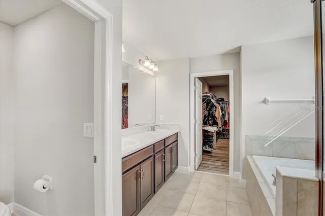 a bathroom with a sink and mirror