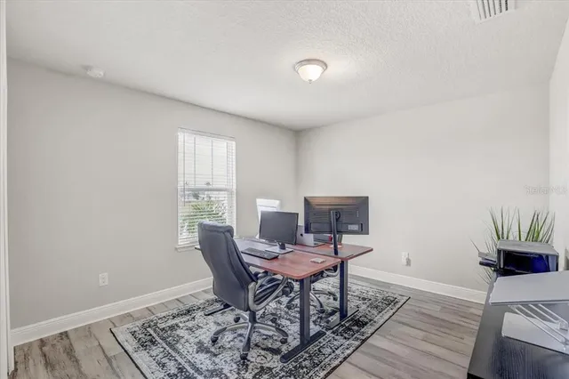 a workspace with furniture and a window