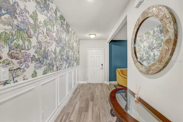 a view of a hallway with washer and dryer