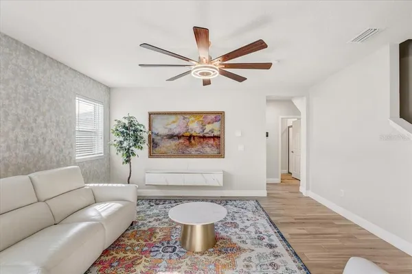 a living room with furniture and a rug