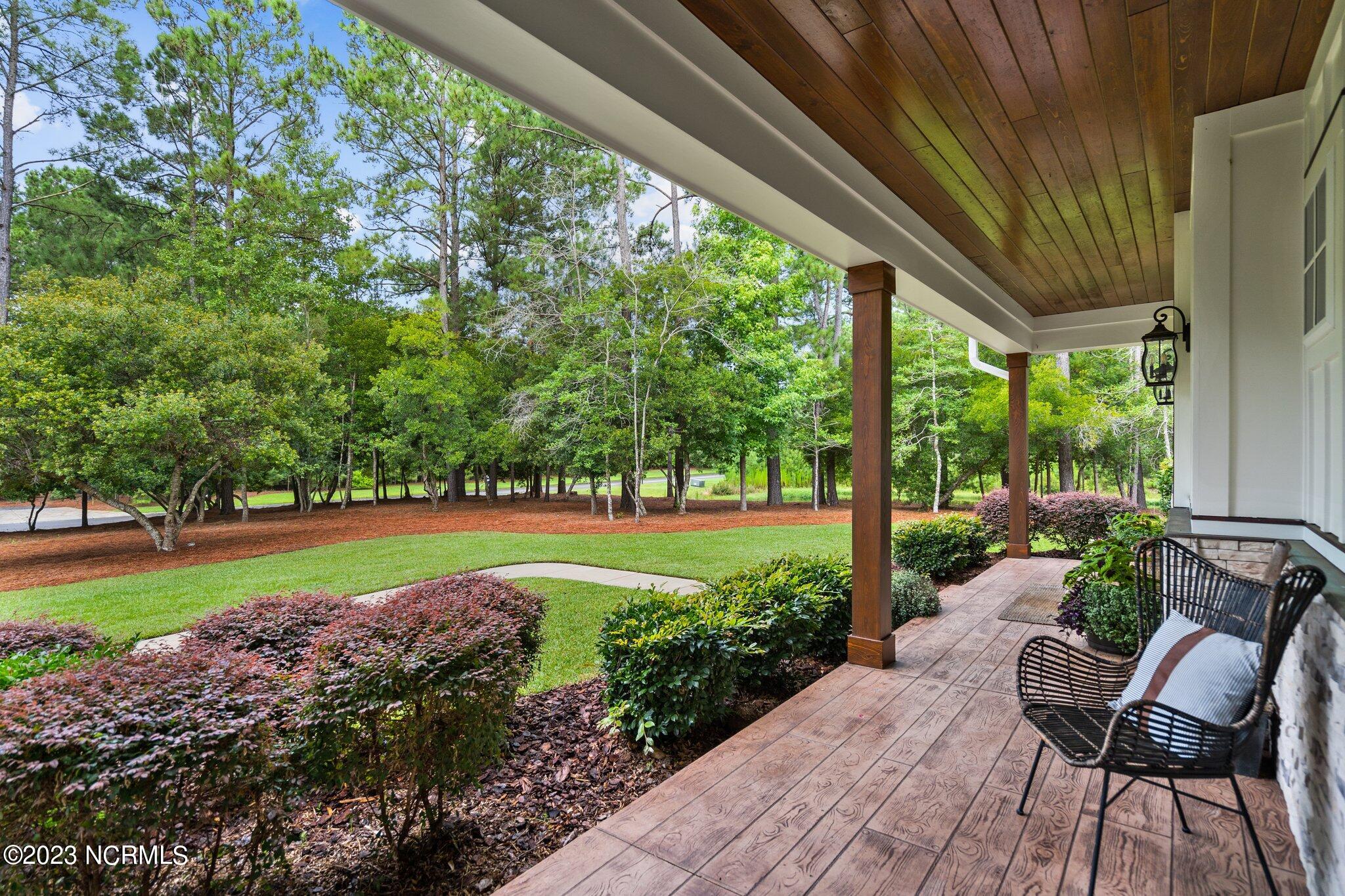 448 Whitebridge Road Hampstead, NC 28443 - Photo 29 of 139 Covered Rear Porch overlooks private front yard