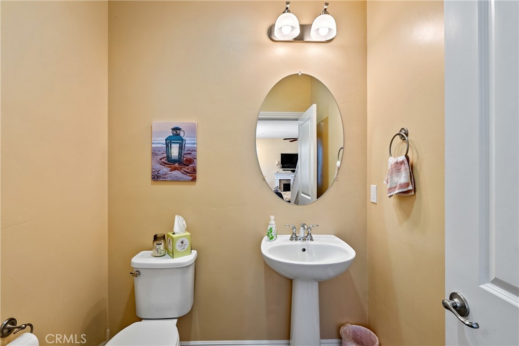 419 Junipero Way San Luis Obispo, CA 93401 - Photo 11 of 29 a bathroom with a sink and mirror with toilet