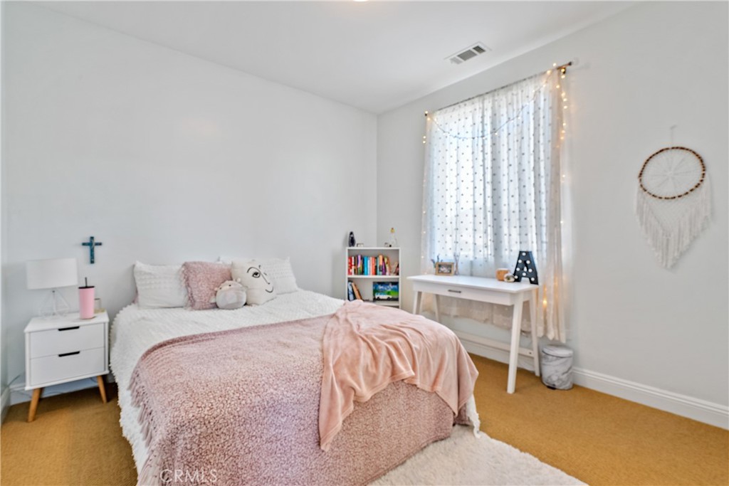 419 Junipero Way San Luis Obispo, CA 93401 - Photo 16 of 29 a bedroom with a bed and a table