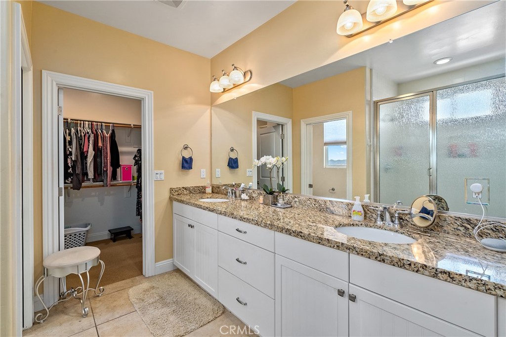 419 Junipero Way San Luis Obispo, CA 93401 - Photo 18 of 29 a en suite bathroom with a granite countertop sink and a mirror
