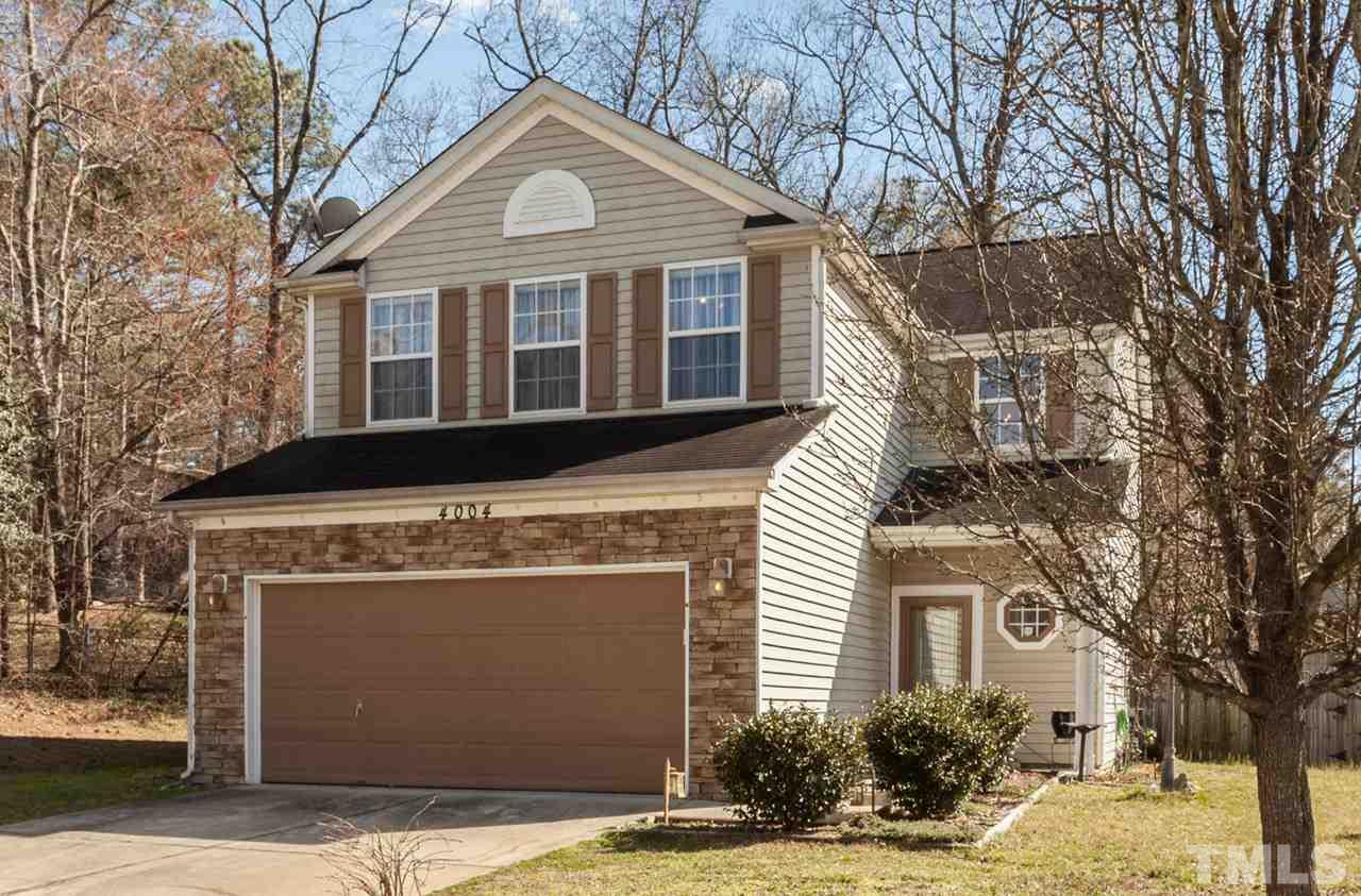 4004 Iverson Street Raleigh, NC 27604 - Photo 1 of 24 a front view of a house with a yard