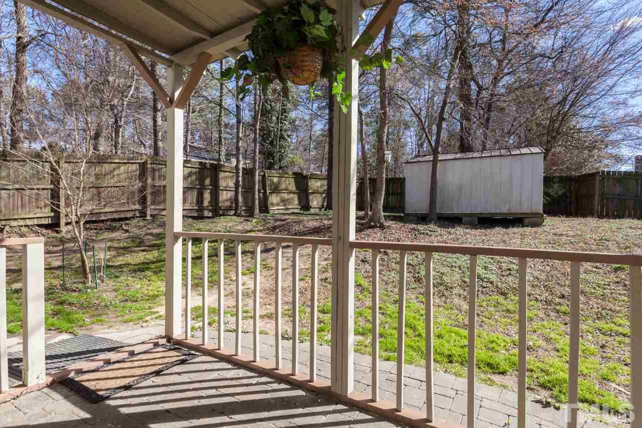 4004 Iverson Street Raleigh, NC 27604 - Photo 21 of 24 a view of a balcony with wooden floor and fence