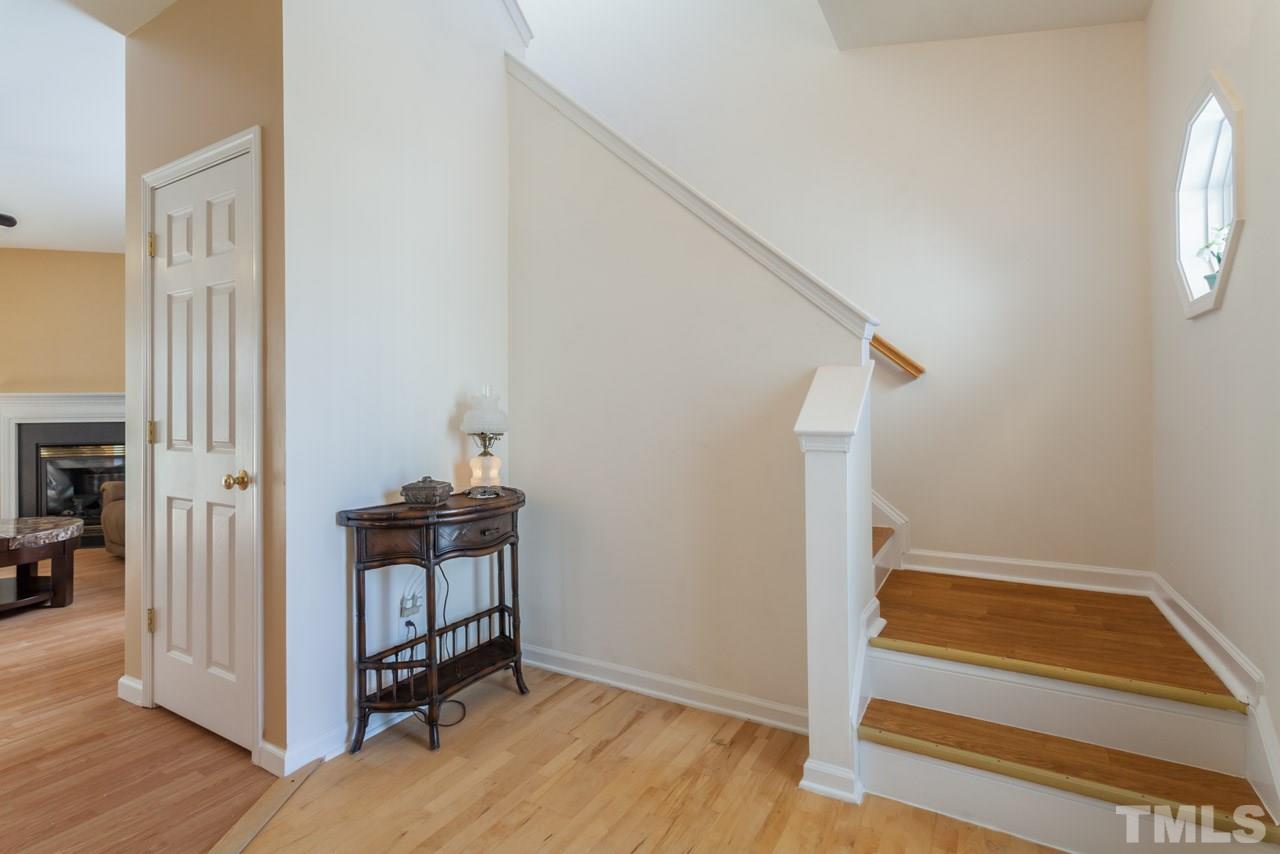 4004 Iverson Street Raleigh, NC 27604 - Photo 4 of 24 a view of entryway with wooden floor and stairs