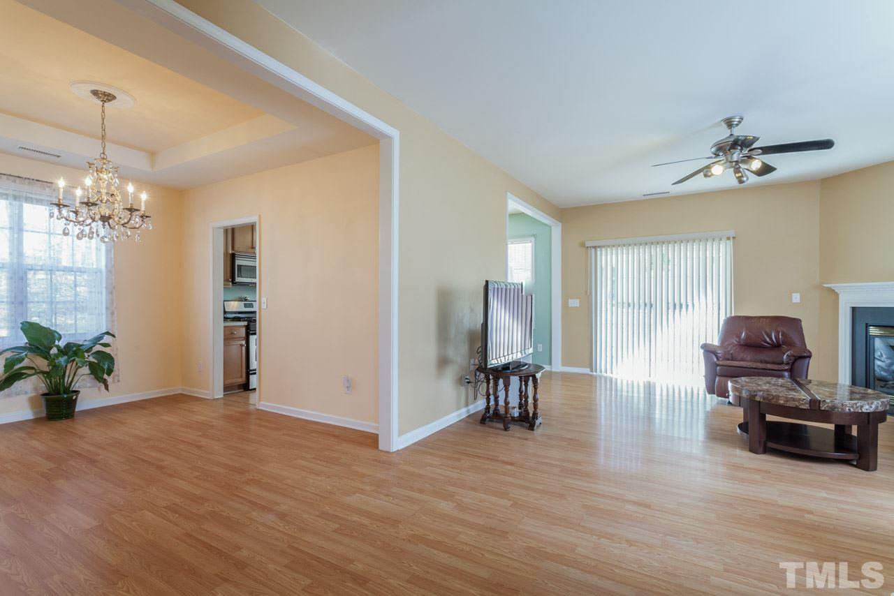 4004 Iverson Street Raleigh, NC 27604 - Photo 5 of 24 a view of a livingroom with furniture window and wooden floor