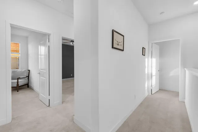 a bedroom with a bed a dresser next to a window