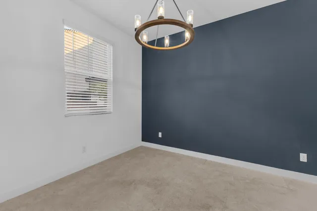 a bedroom with bed and a window