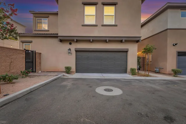 a view of a pathway both side of the house