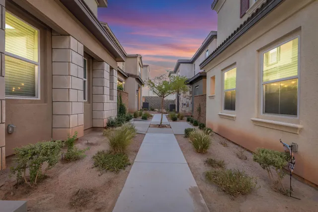 an aerial view of residential houses with city view