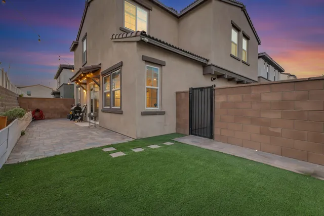 a view of a lake with a table and chairs