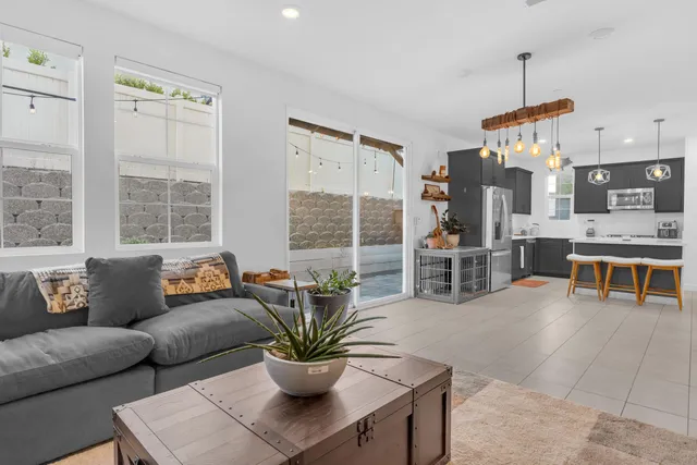 a dining room with furniture and wooden floor