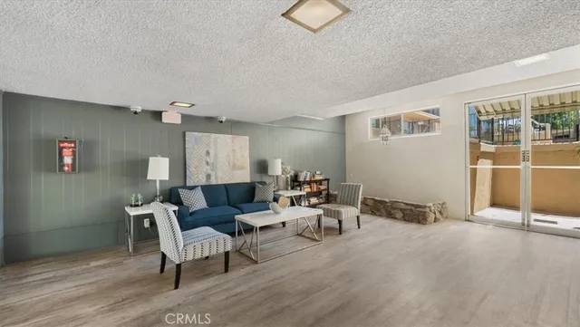 a view of a building with a bench in a patio