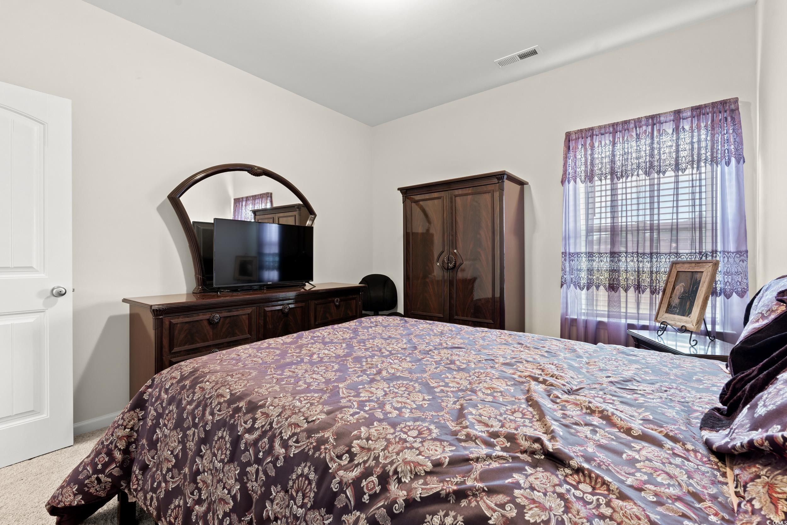 327 Fox Bay Road Loris, SC 29569 - Photo 13 of 23 Bedroom featuring light carpet