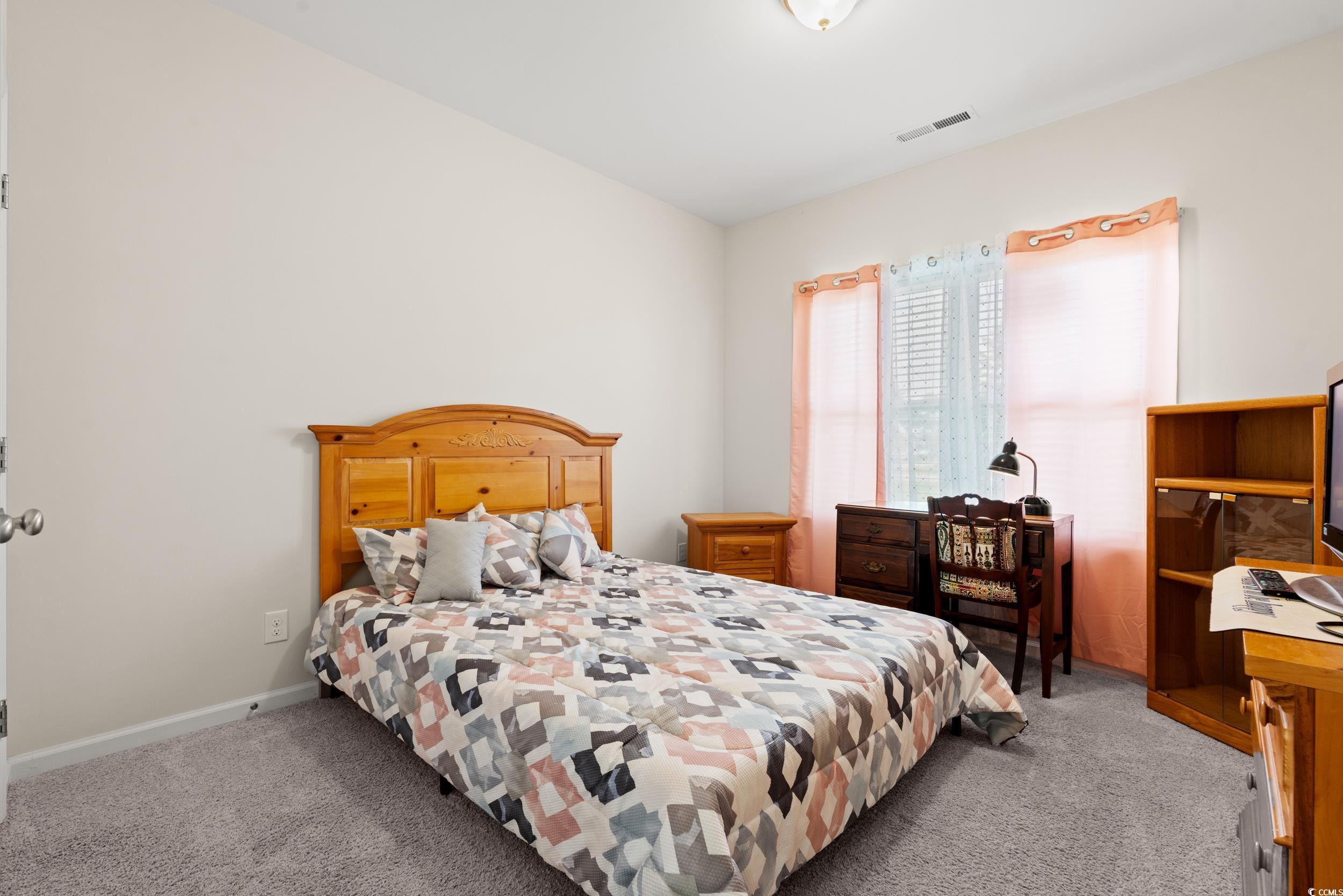 327 Fox Bay Road Loris, SC 29569 - Photo 15 of 23 Bedroom with light colored carpet and baseboards.