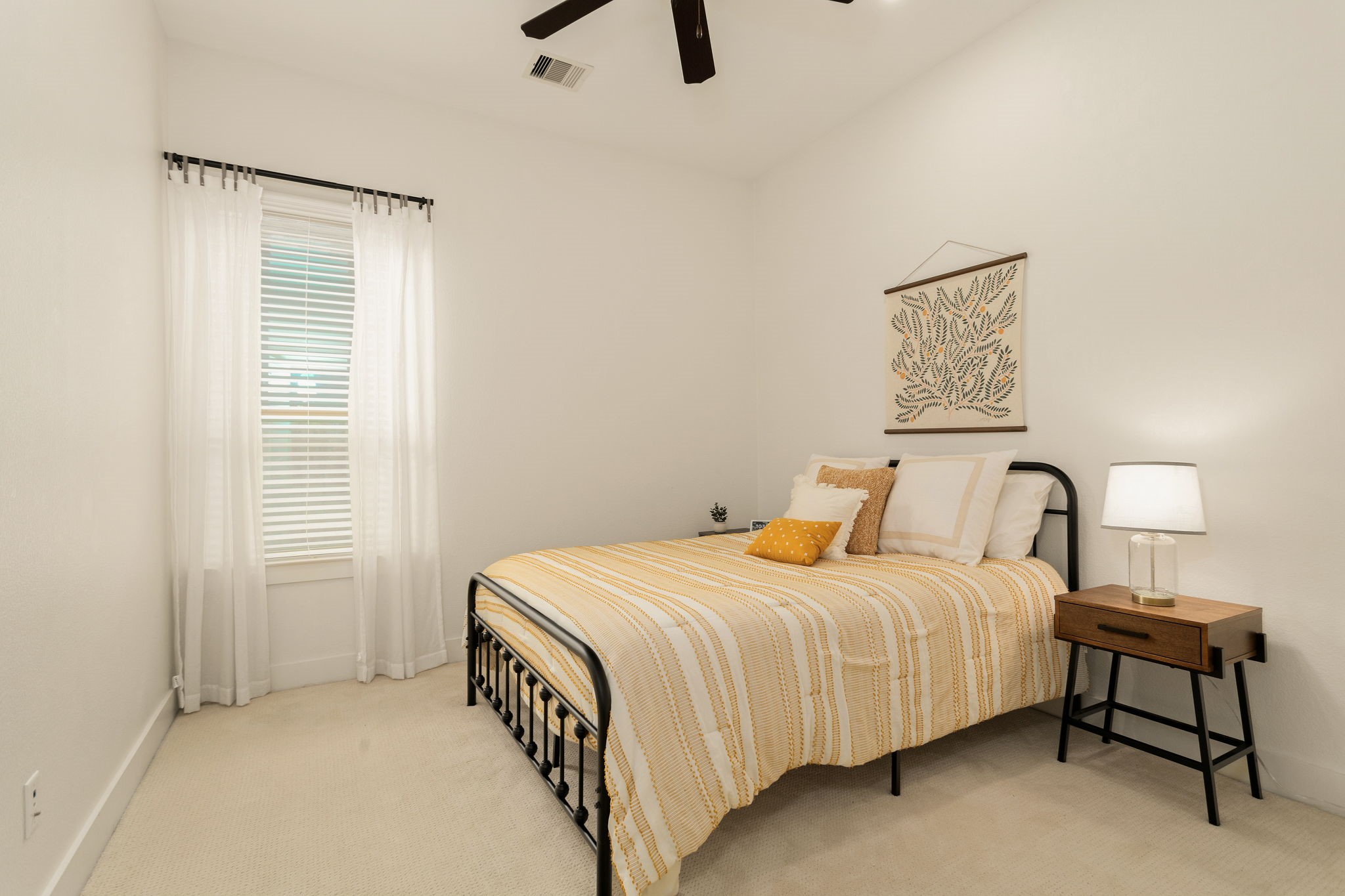 16650 Seminole Ridge Drive Cypress, TX 77433 - Photo 18 of 27 a bedroom with a bed a table and painting